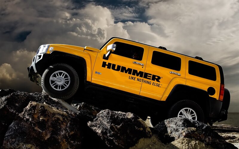 Yellow Hummer on rocky terrain