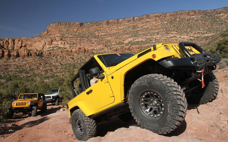 Yellow Jeep on Rocky Terrain