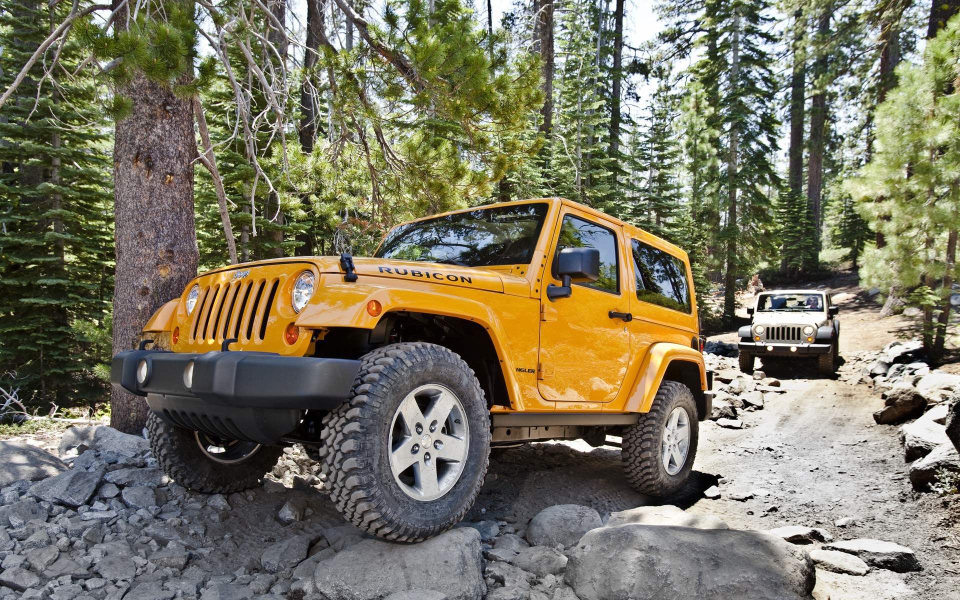 Yellow Jeep Rubicon off-roading