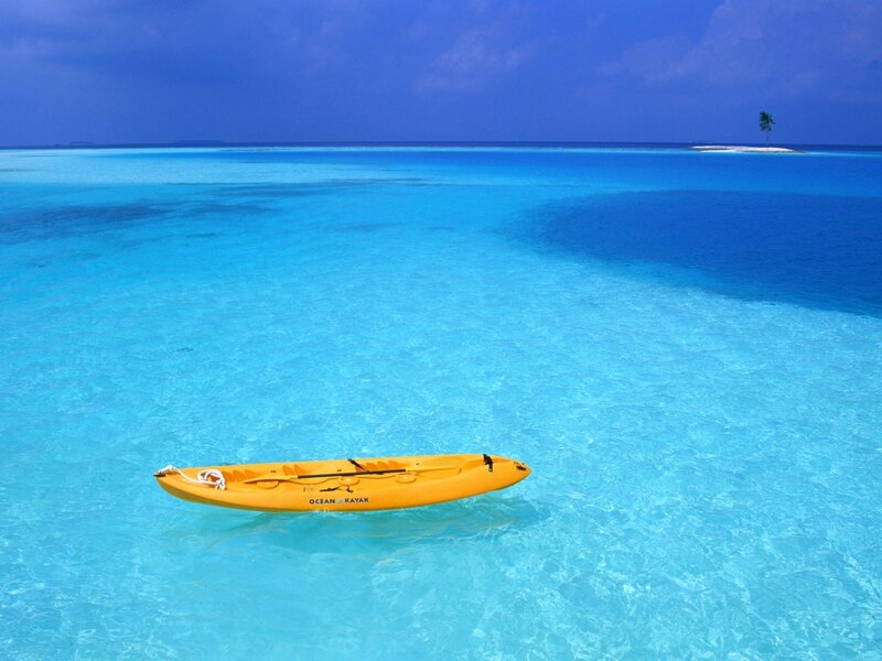 Yellow kayak in turquoise water