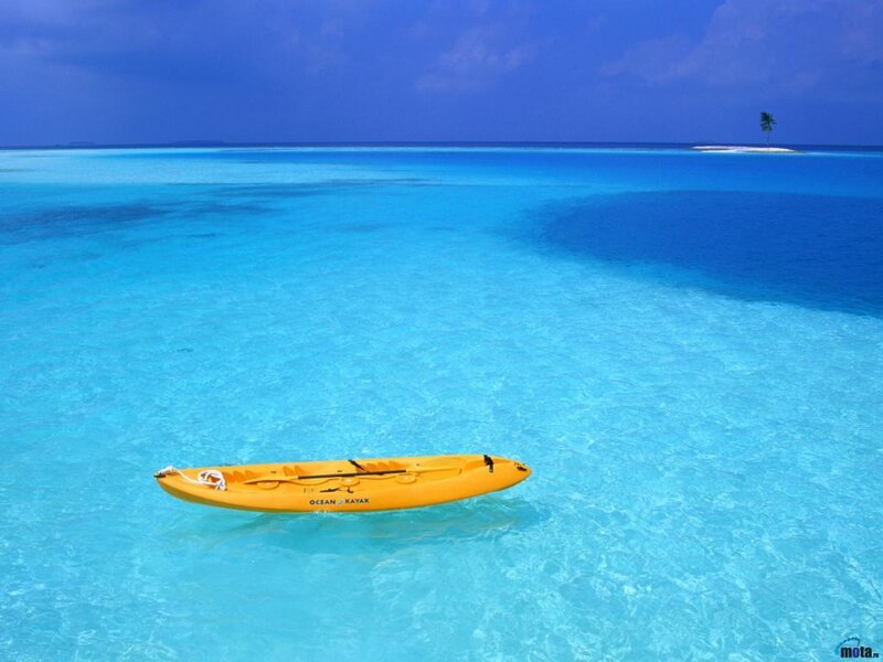 Yellow kayak in turquoise water