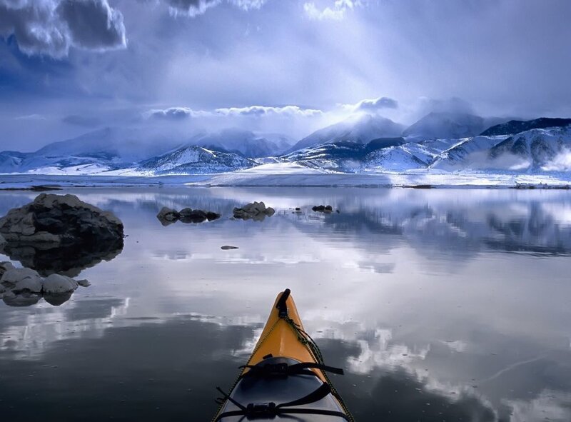 Yellow Kayak on Lake — Blue, Serene, Winter, Photograph, Mountains, Rocks, Clouds, Gray