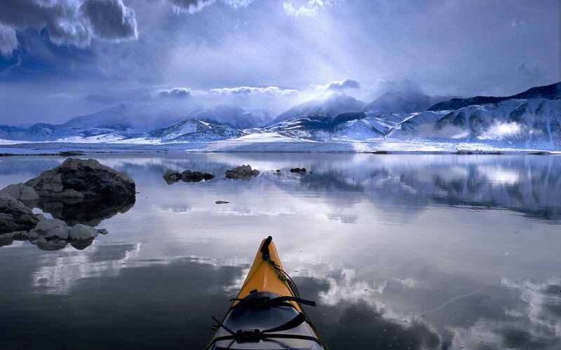 Yellow Kayak on Lake — Blue, Serene, Winter, Photograph, Mountains, Rocks, Clouds