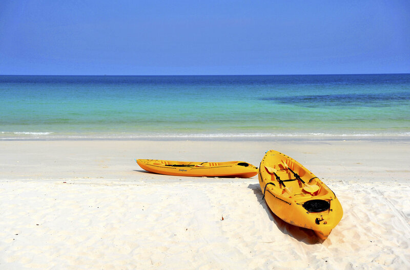 Yellow Kayaks on Beach — Serene