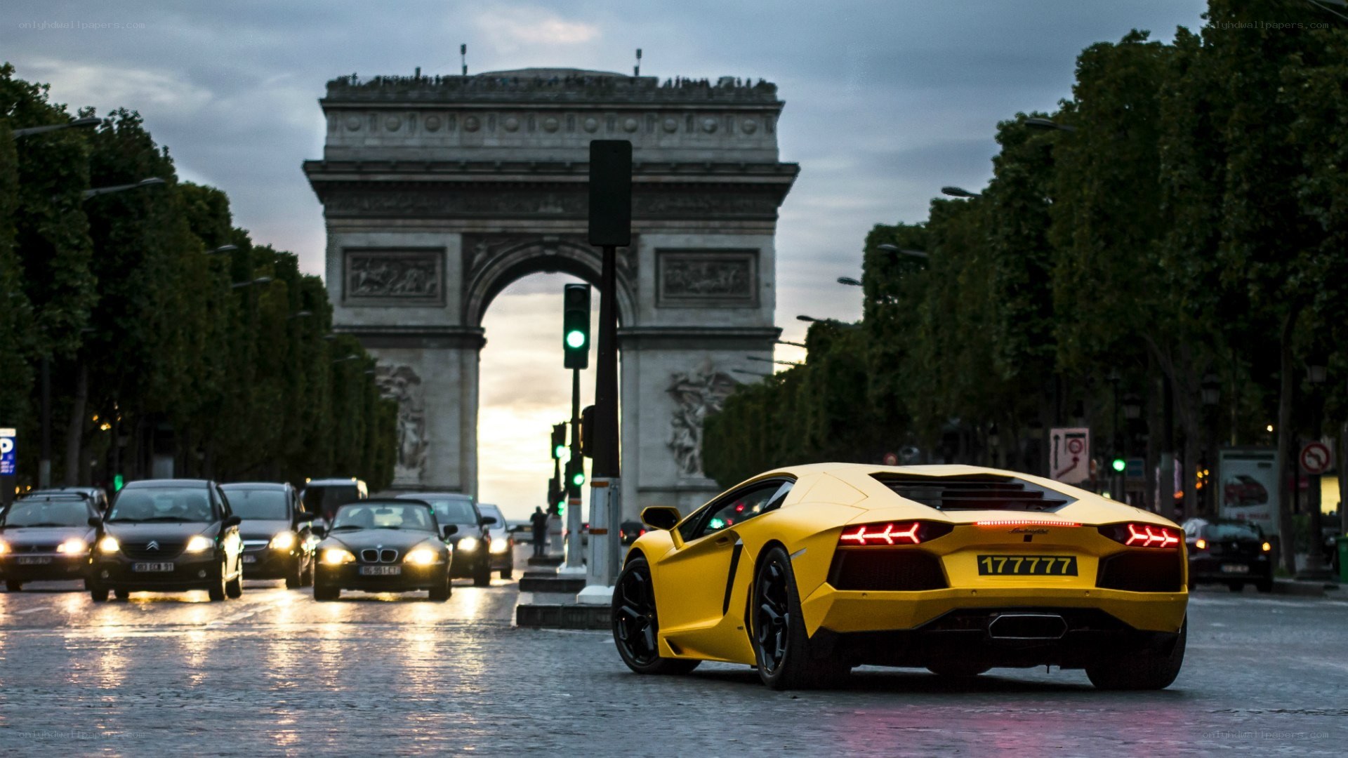 Yellow Lamborghini at Arc de Triomphe