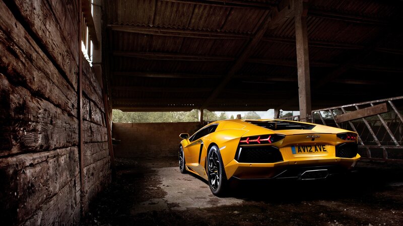 Yellow Lamborghini in barn