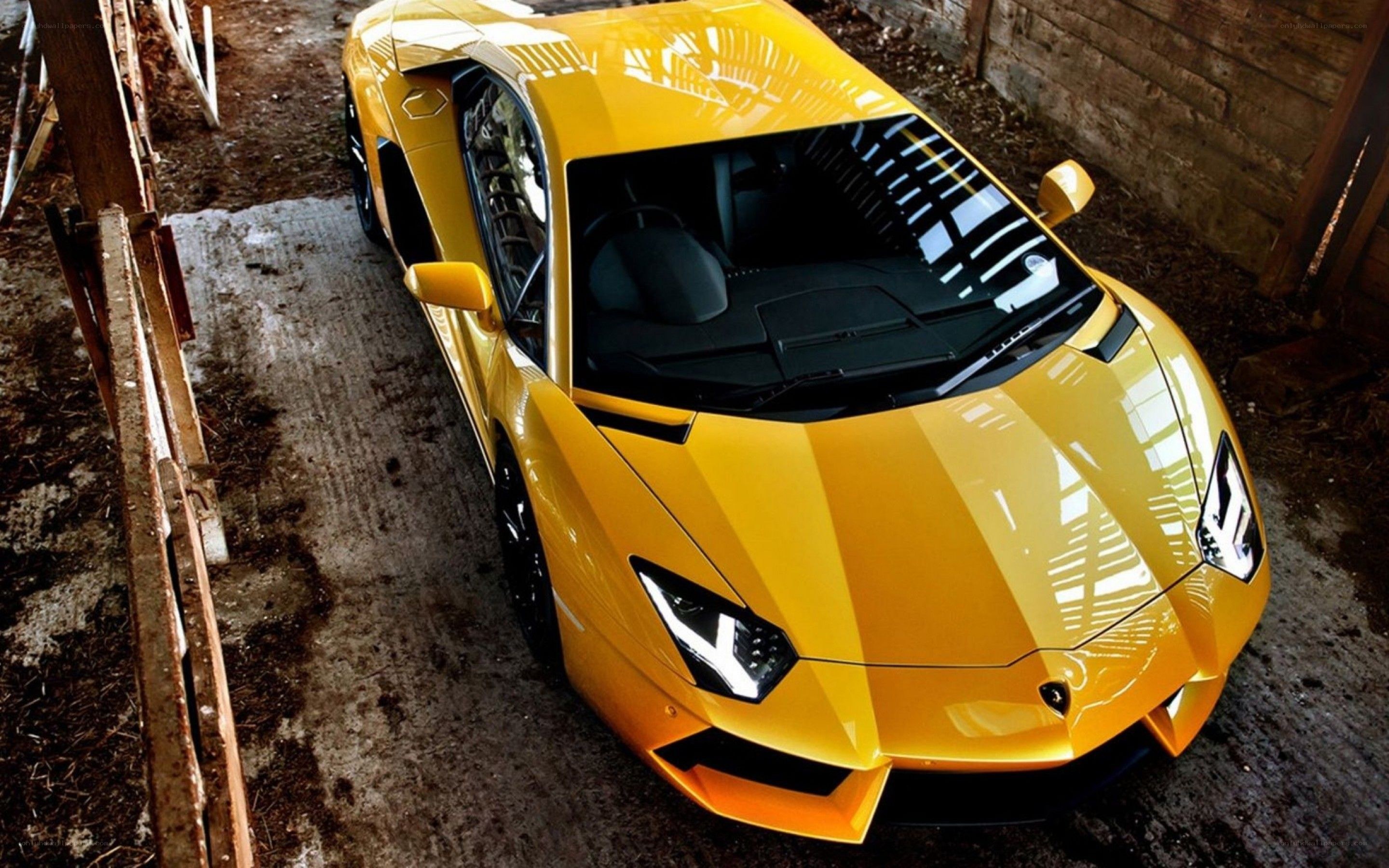 Yellow Lamborghini in barn