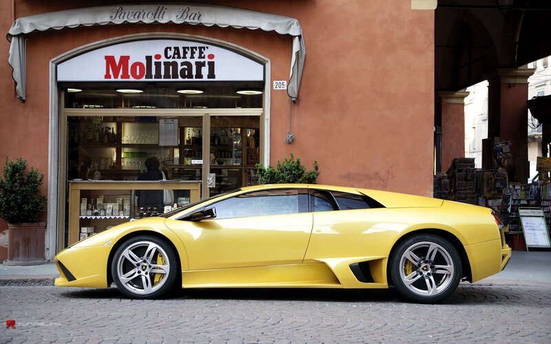 Yellow Lamborghini in front of cafe