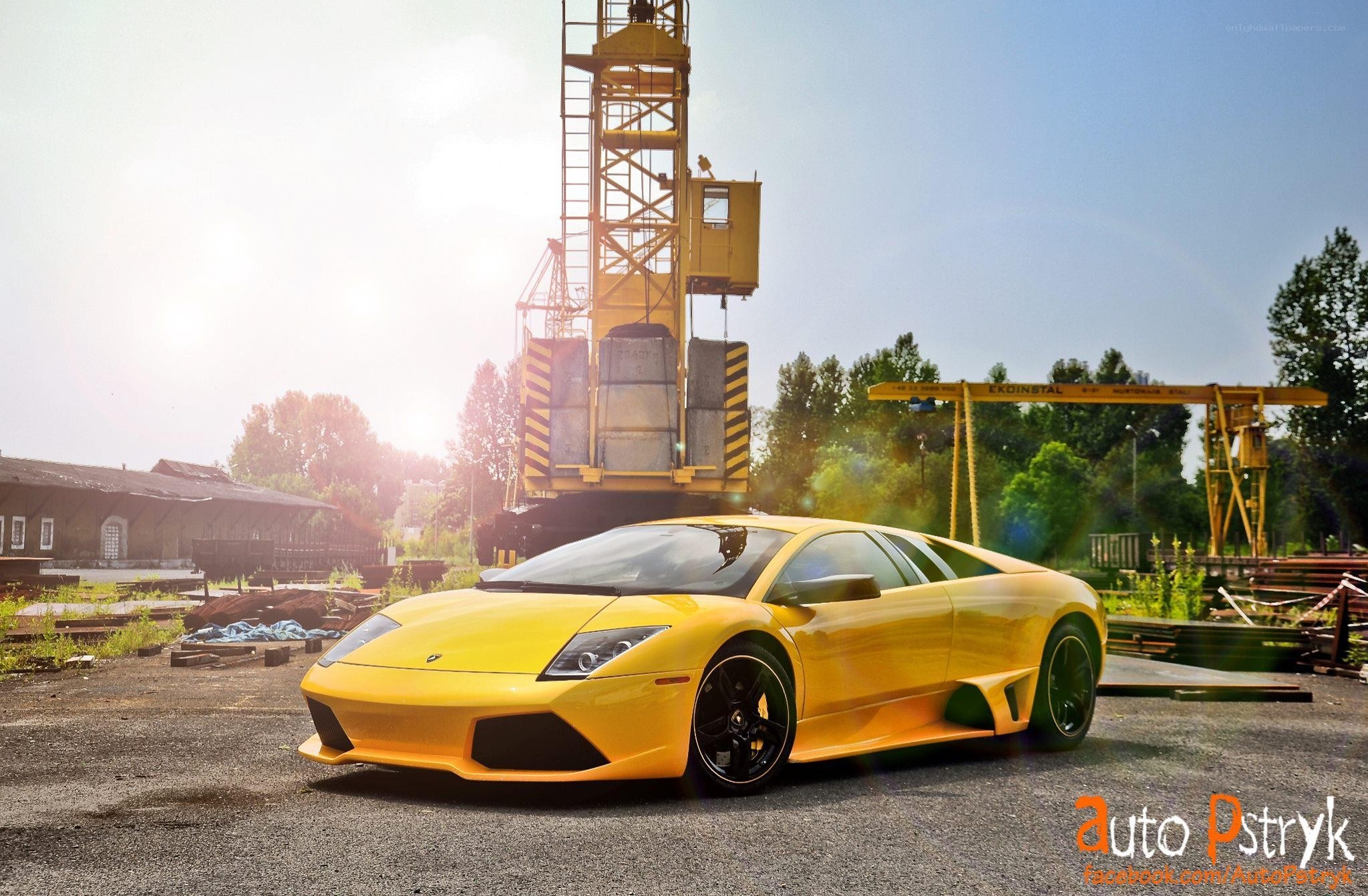 Yellow Lamborghini in industrial setting
