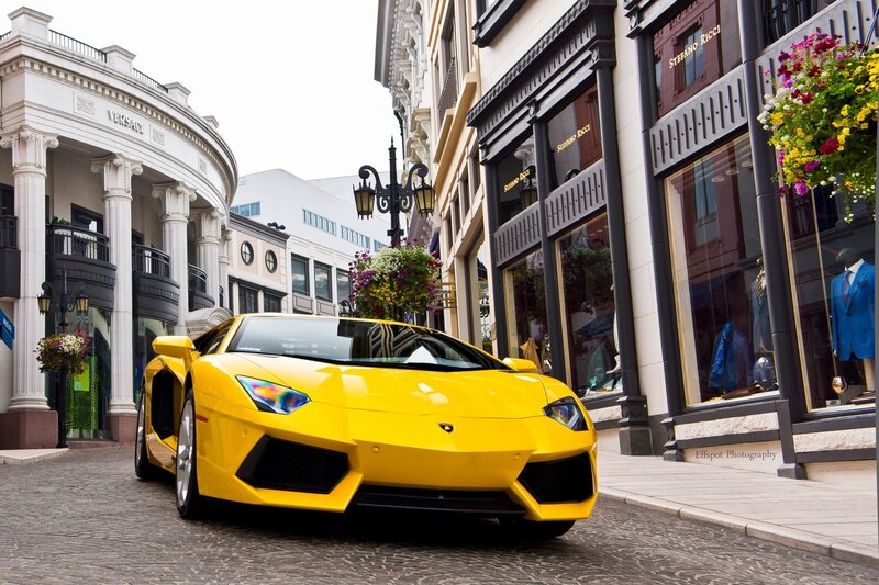 Yellow Lamborghini in luxury shopping area