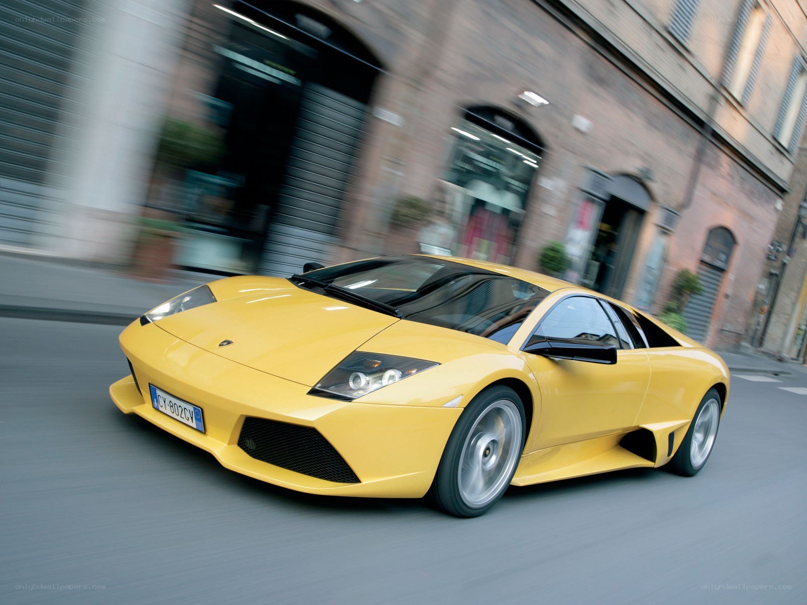 Yellow Lamborghini in motion