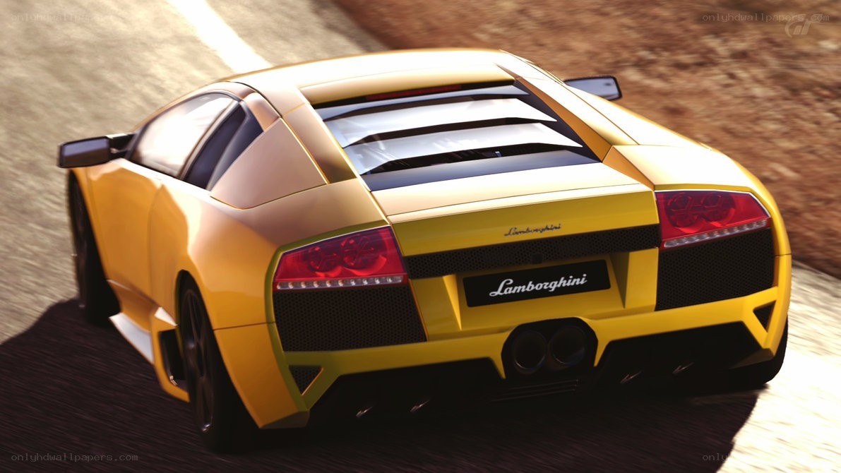 yellow lamborghini in motion