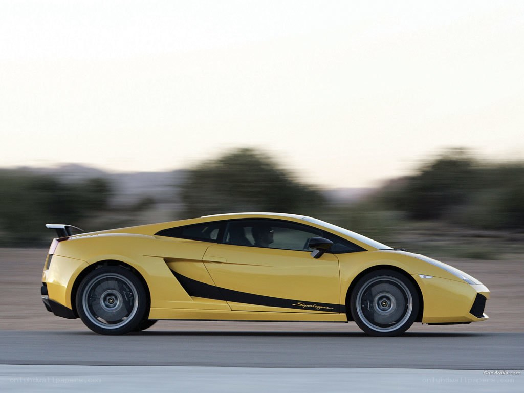 yellow lamborghini in motion