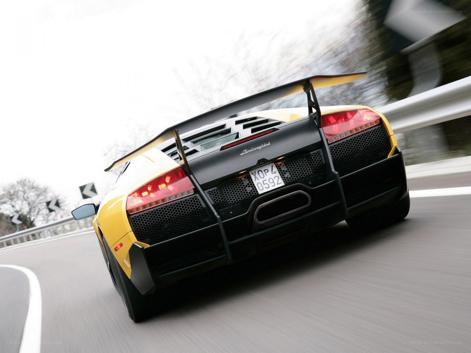 yellow lamborghini in motion