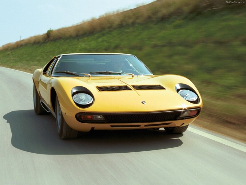 Yellow Lamborghini Miura in motion