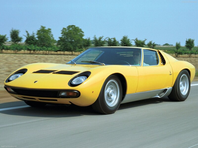 Yellow Lamborghini Miura in motion