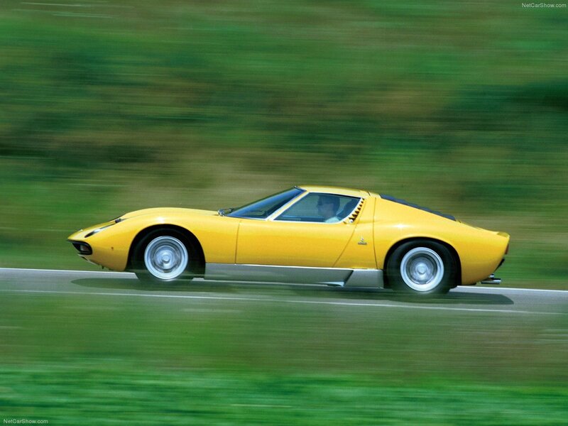 Yellow Lamborghini Miura in motion