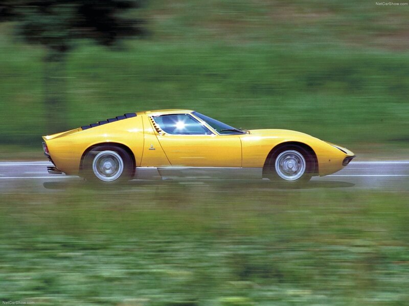 Yellow Lamborghini Miura in motion