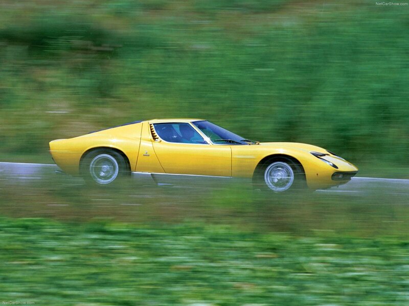Yellow Lamborghini Miura in motion