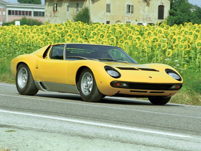 Yellow Lamborghini Miura on road