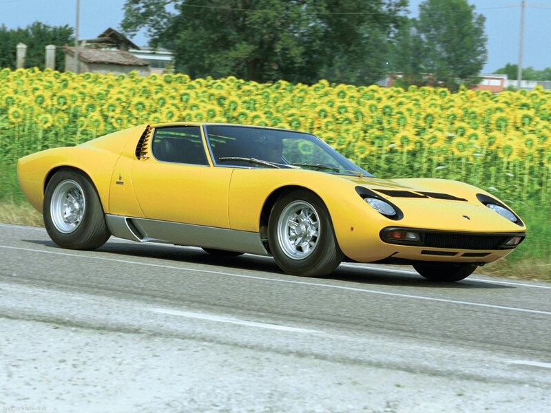 Yellow Lamborghini Miura on road