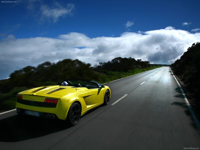 Yellow Lamborghini on a coastal road