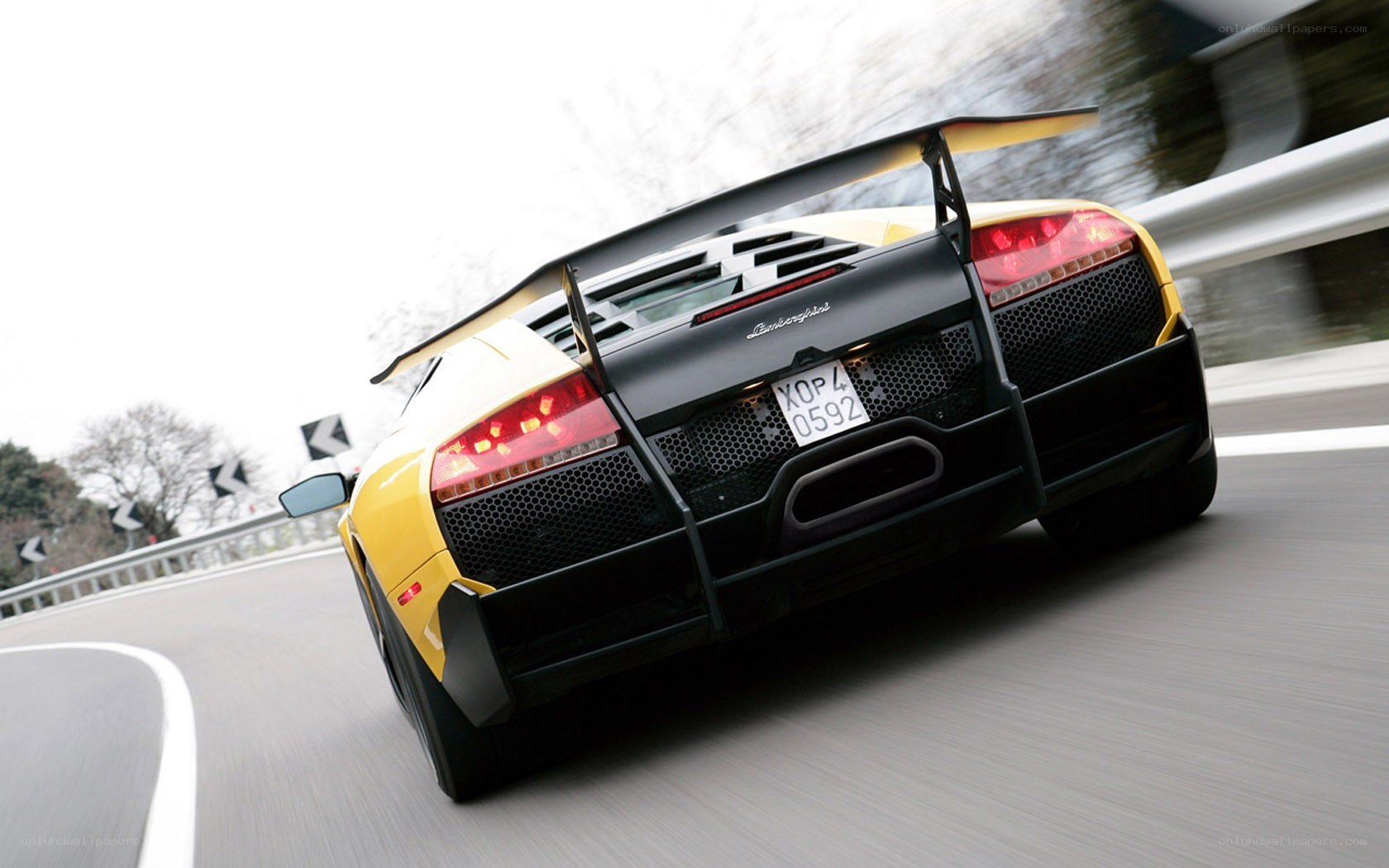 Yellow Lamborghini on a road