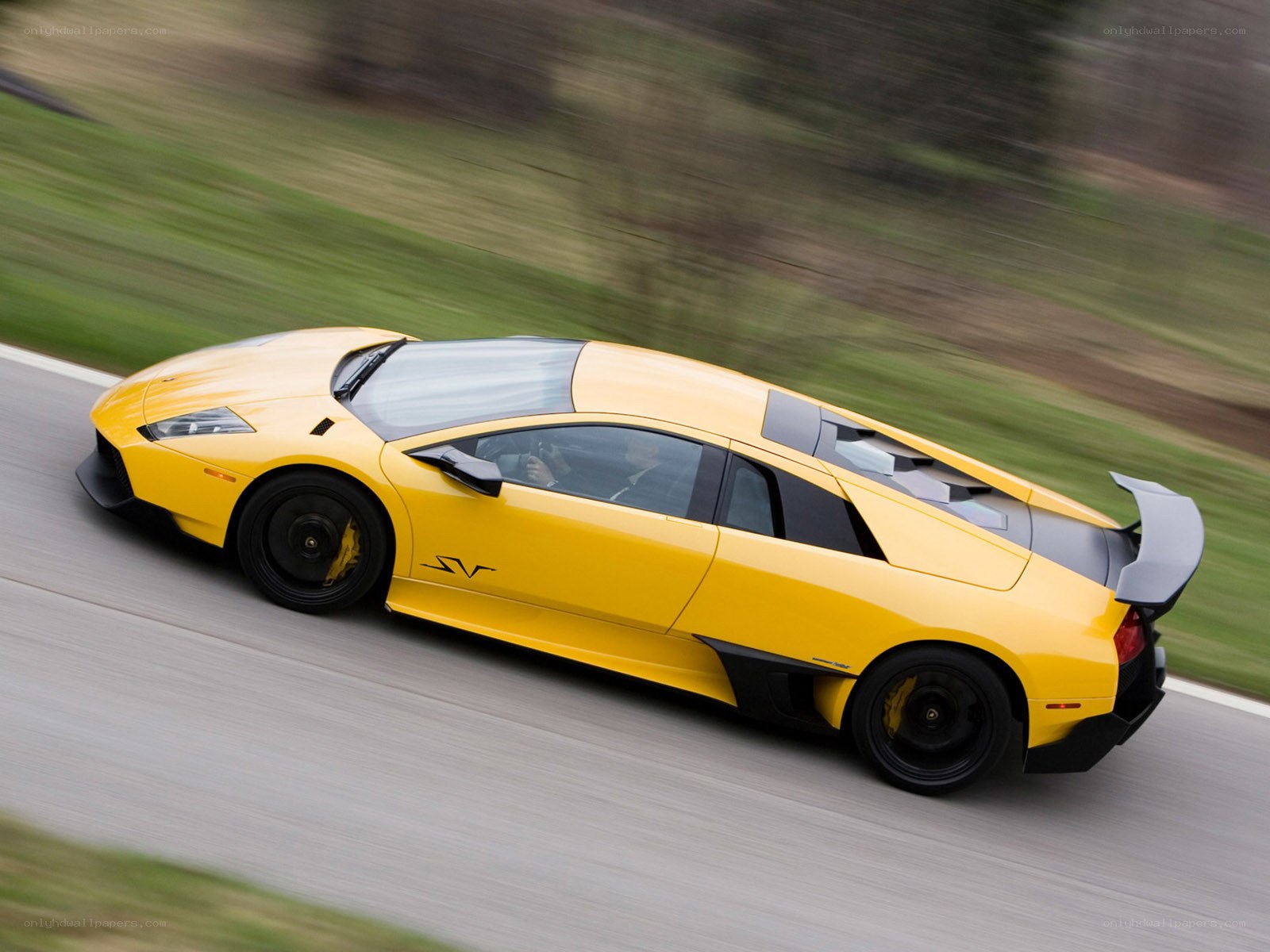 Yellow Lamborghini on a road