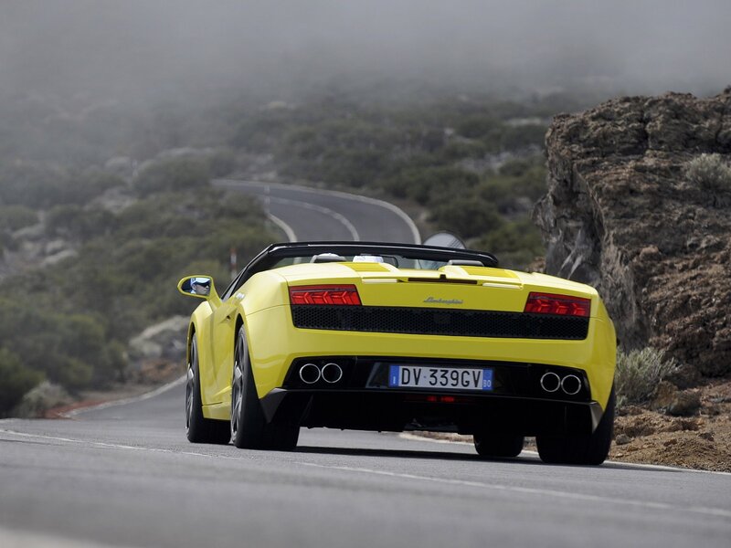 Yellow Lamborghini on a winding road