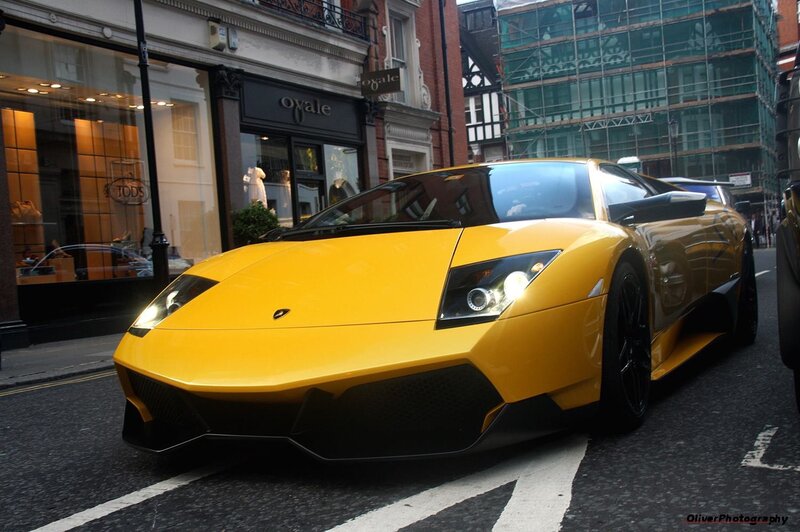 yellow lamborghini on city street