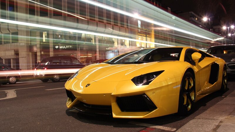 Yellow Lamborghini on city street
