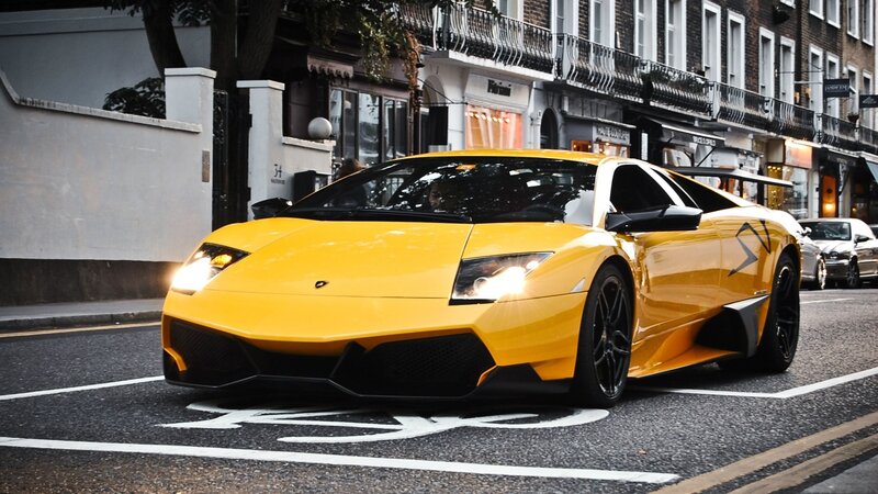 yellow lamborghini on city street