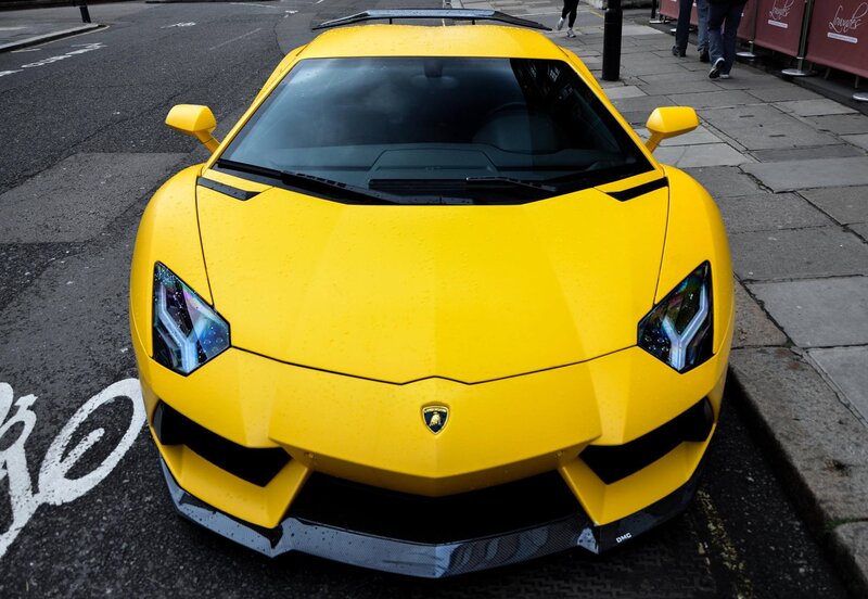 Yellow Lamborghini on city street