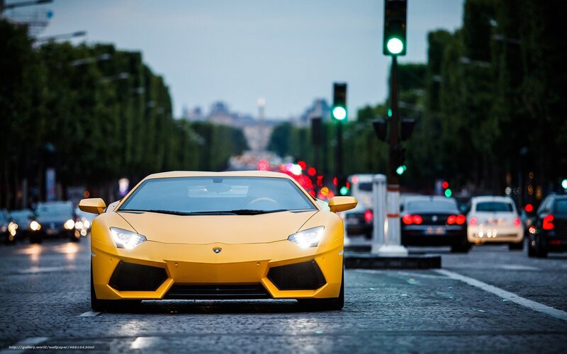 Yellow Lamborghini on city street