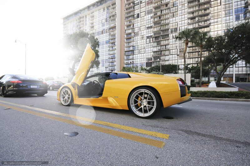 Yellow Lamborghini on city street