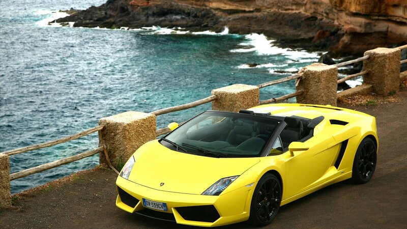 Yellow Lamborghini on coastal road