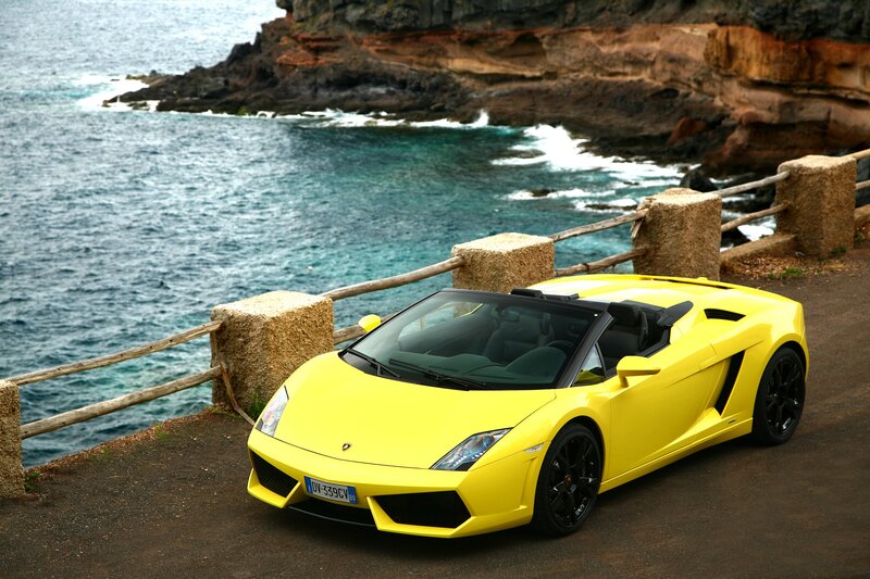 Yellow Lamborghini on coastal road