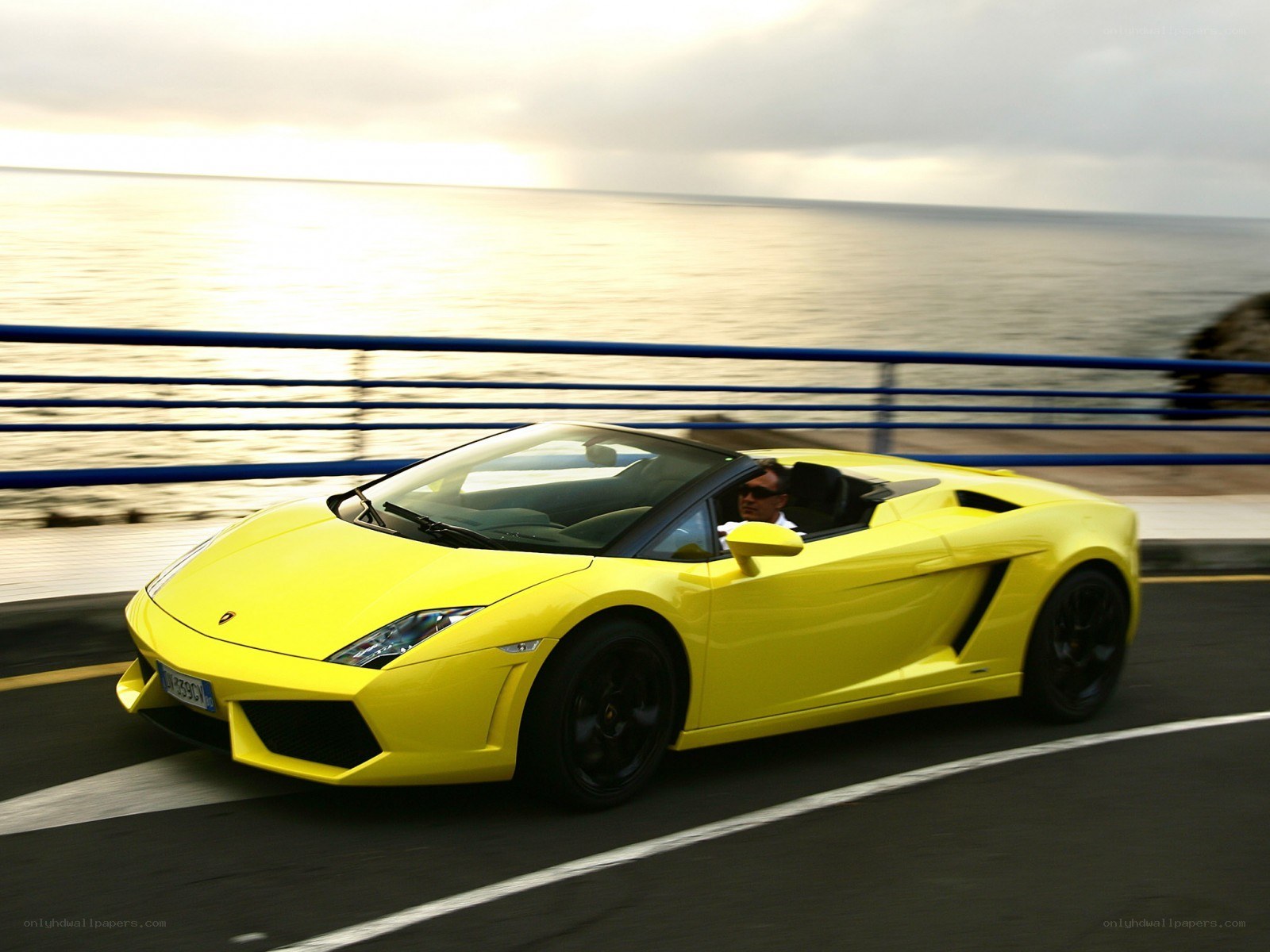 Yellow Lamborghini on coastal road