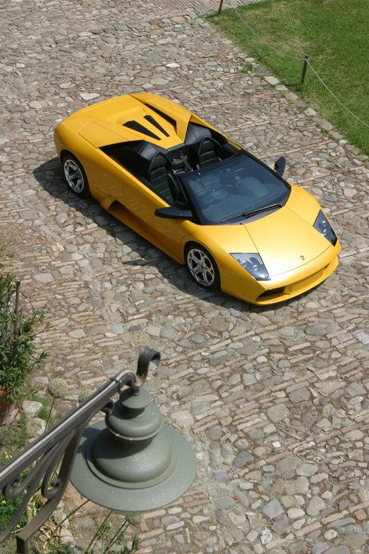 Yellow Lamborghini on cobblestones
