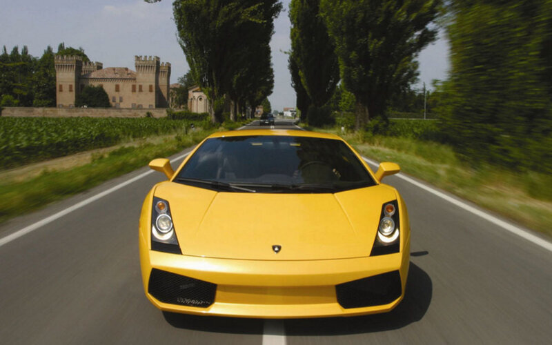 Yellow Lamborghini on country road