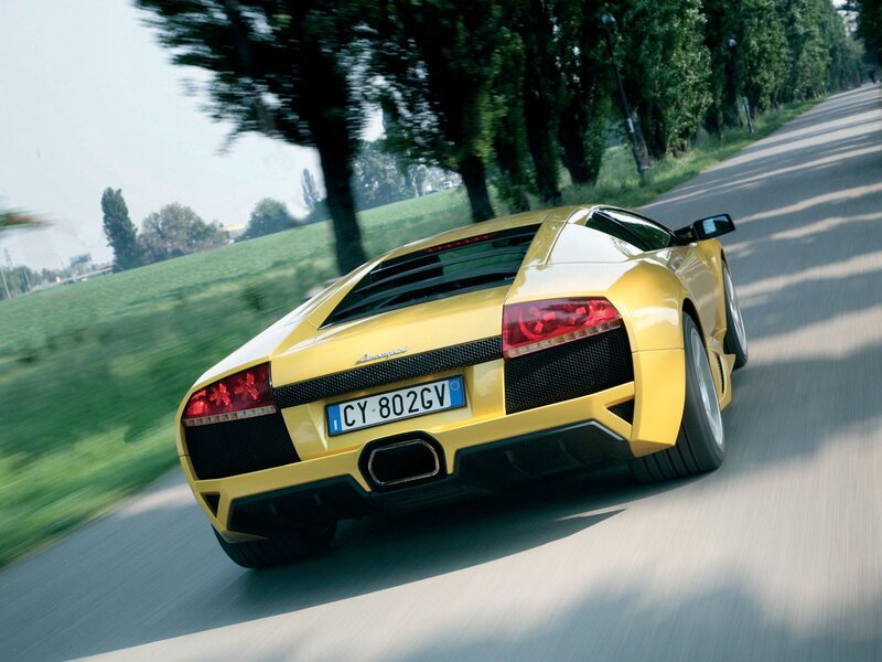 yellow lamborghini on country road