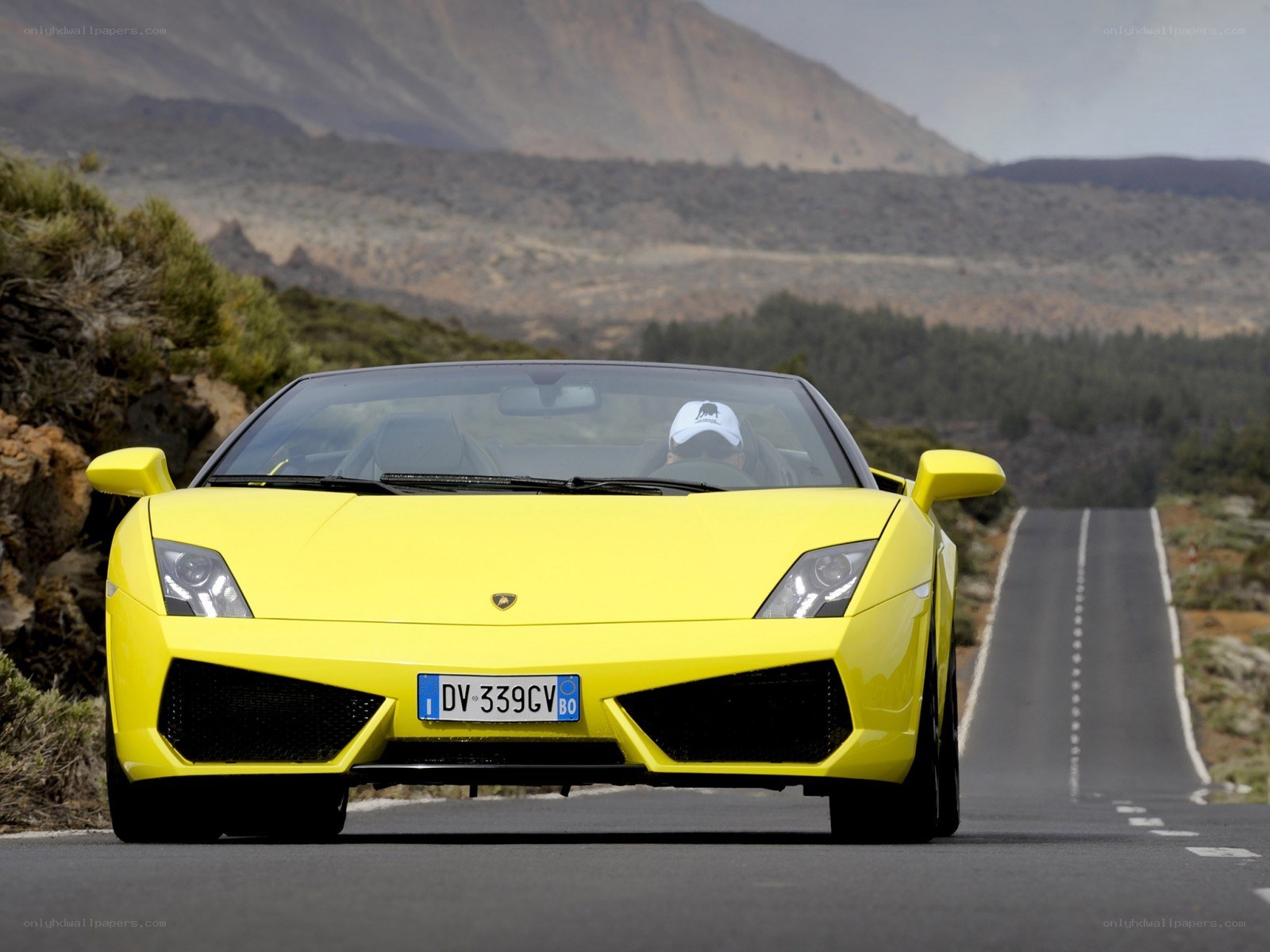 Yellow Lamborghini on mountain road