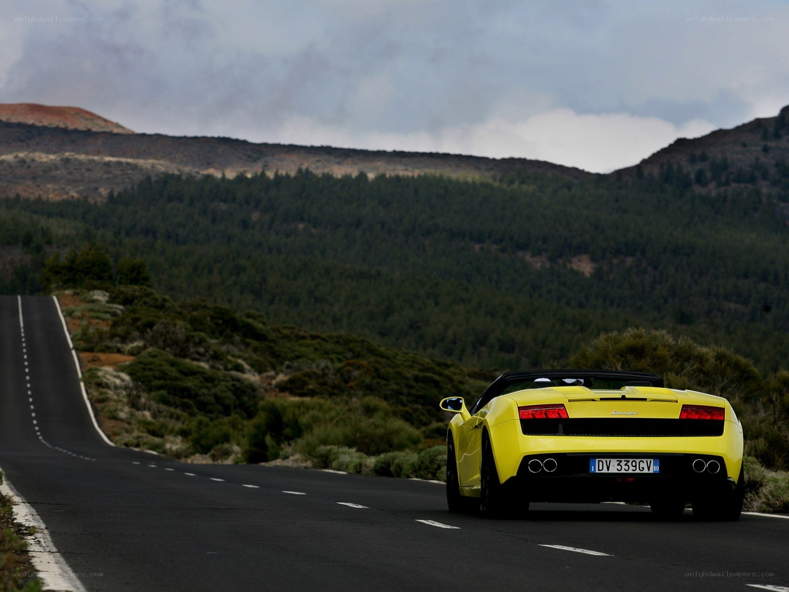 Yellow Lamborghini on mountain road