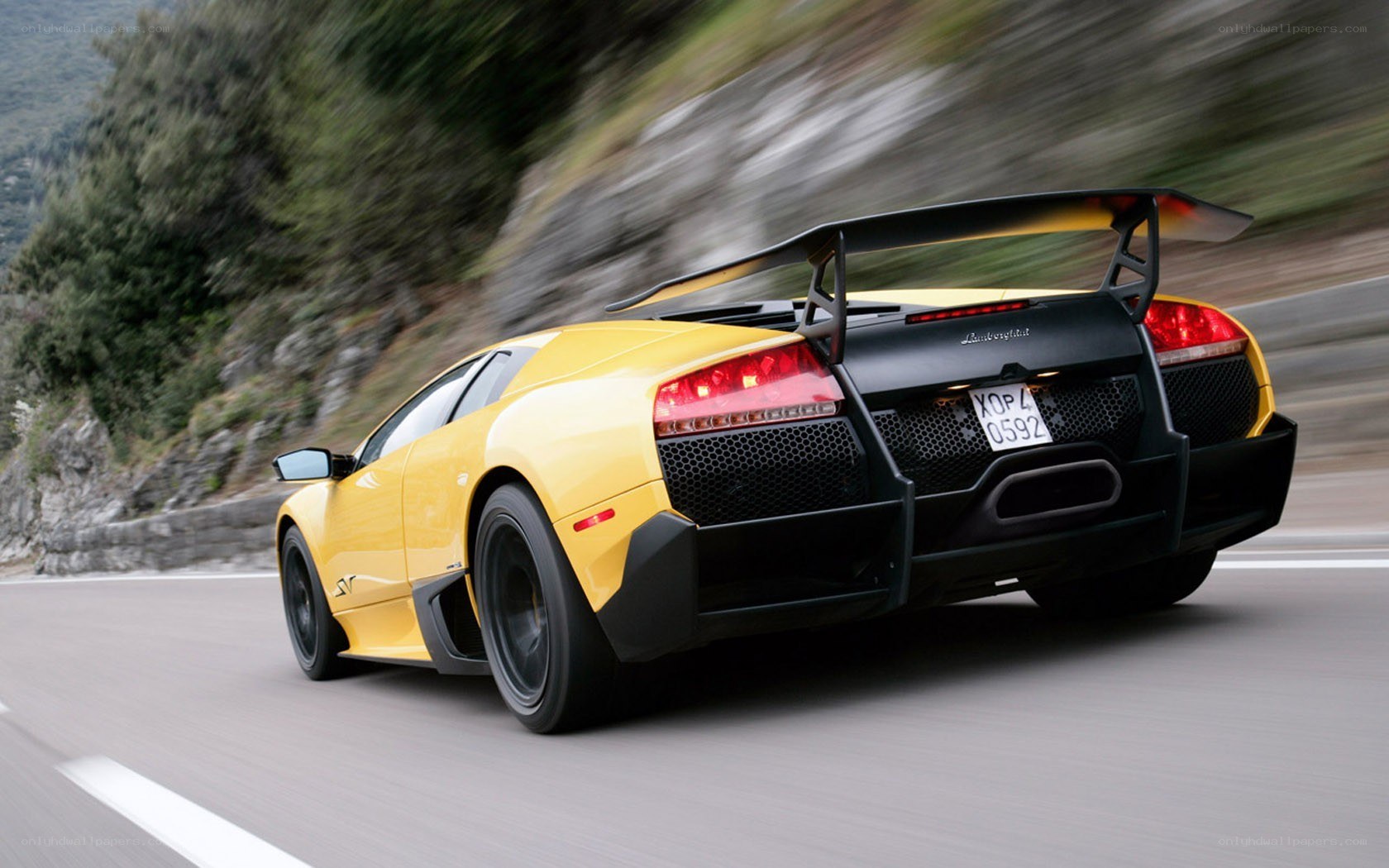Yellow Lamborghini on mountain road