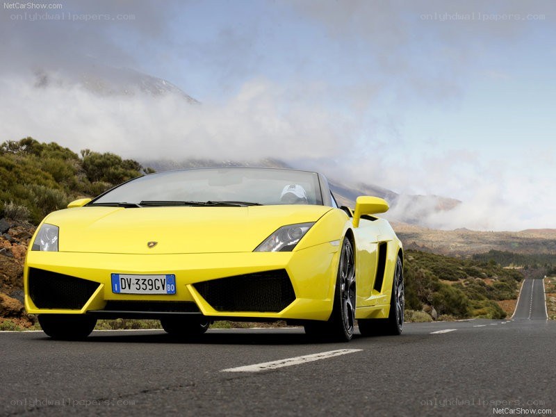 yellow lamborghini on mountain road