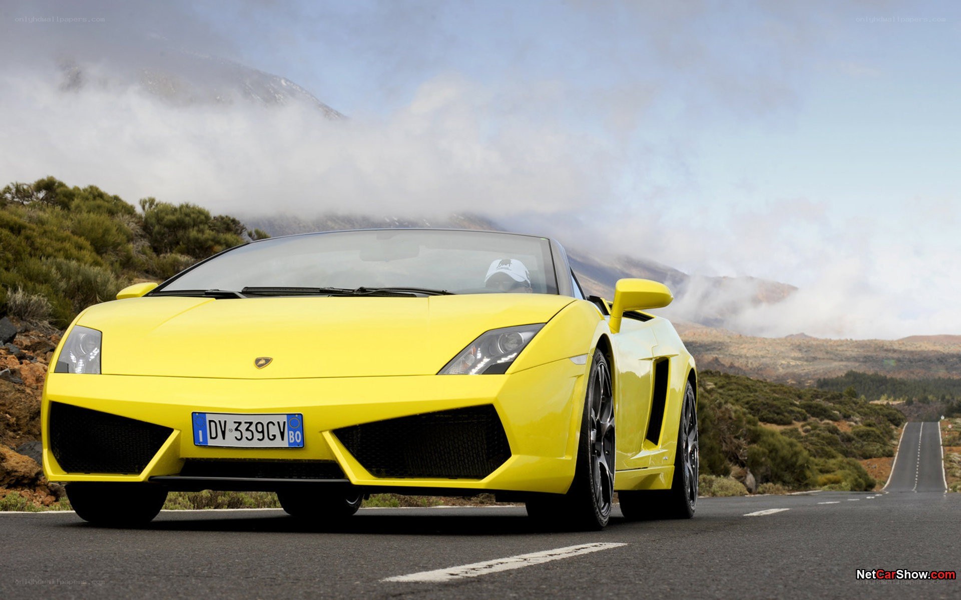 Yellow Lamborghini on mountain road