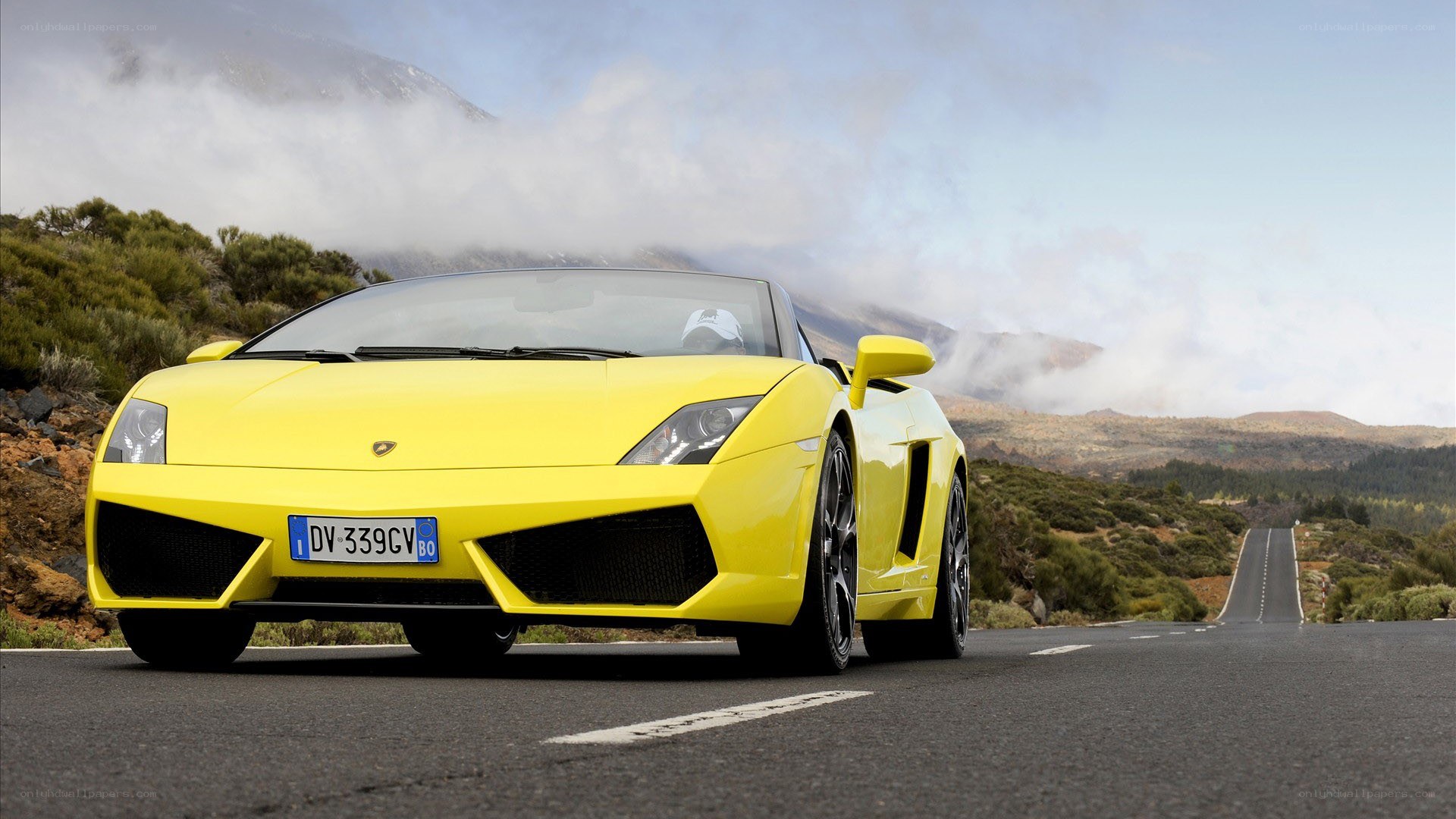 Yellow Lamborghini on mountain road
