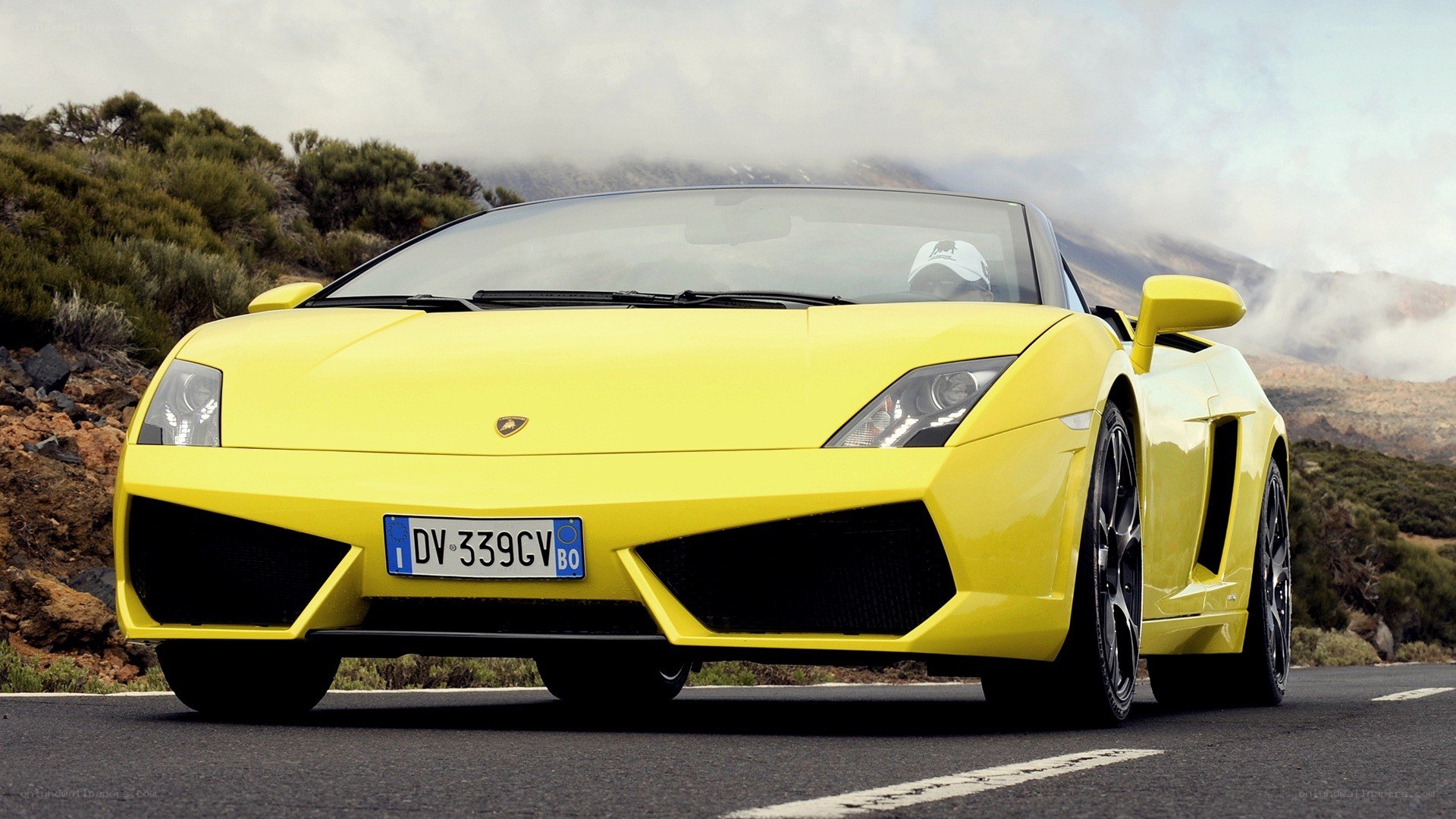 Yellow Lamborghini on mountain road