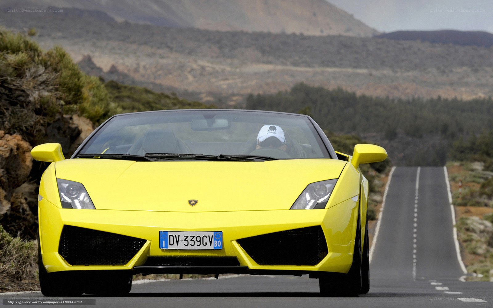 Yellow Lamborghini on mountain road