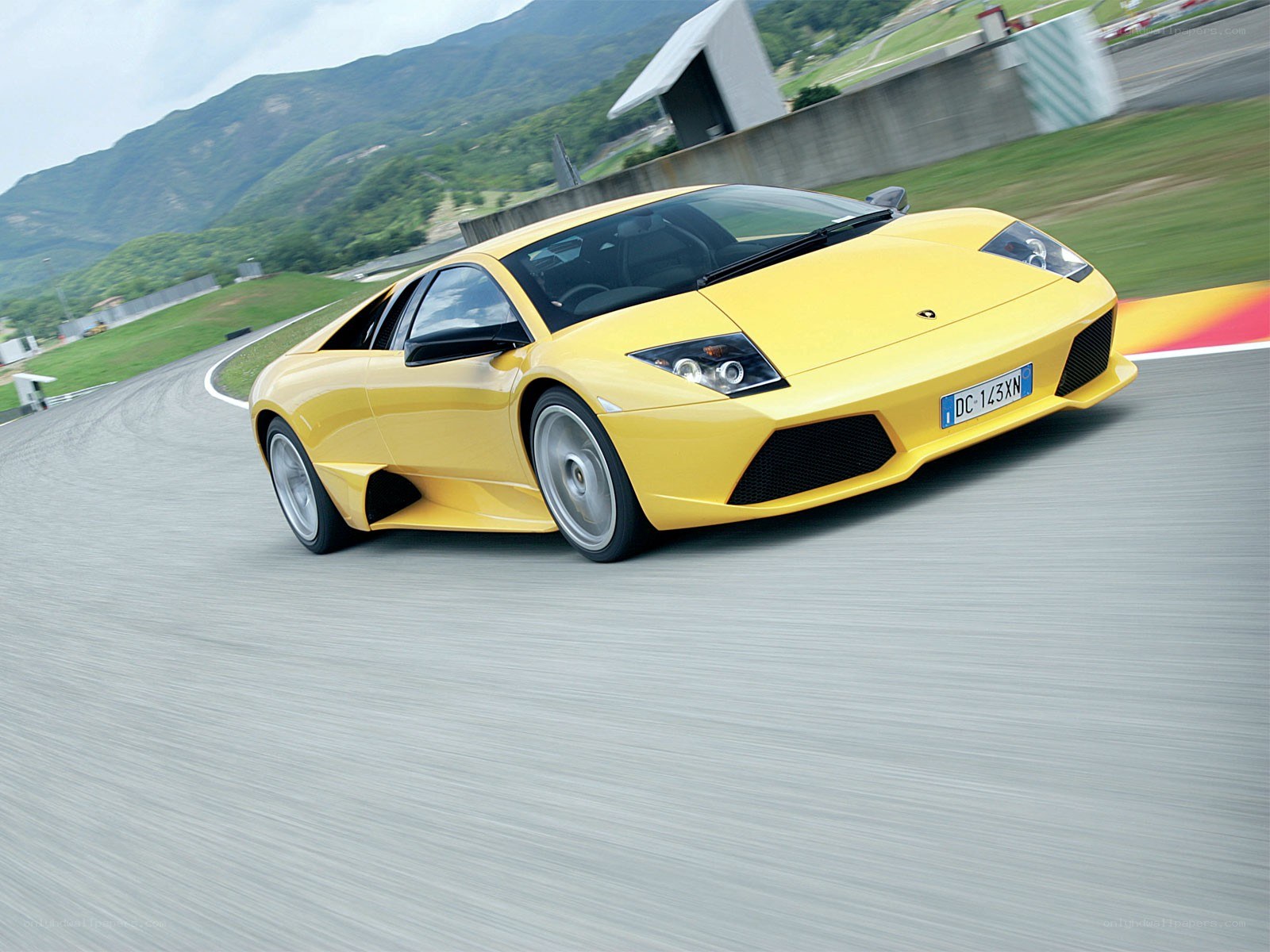 Yellow Lamborghini on racetrack